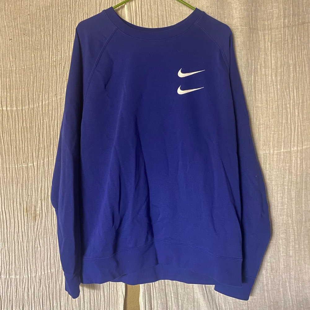 Blue Nike sportswear swoosh